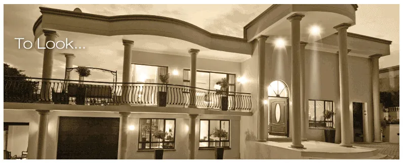 Modern twostory house with balconies and columns sepia tone text To Look