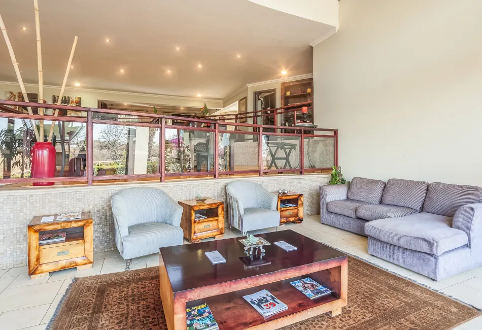 Modern lounge area with sofas armchairs and a coffee table
