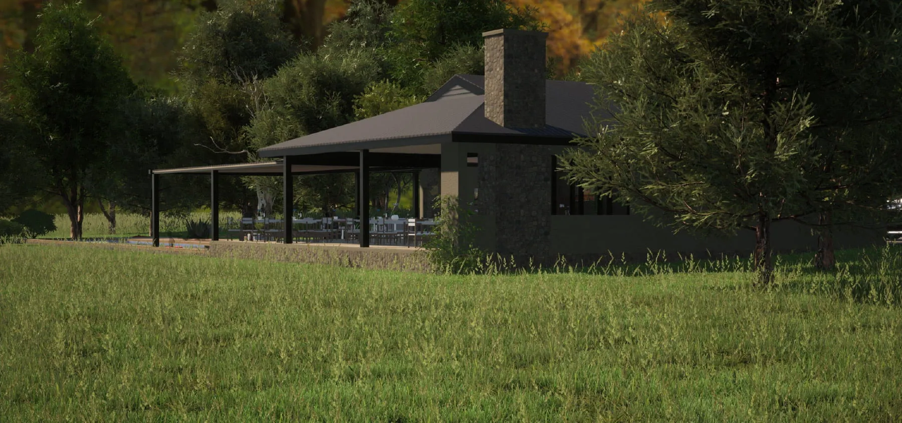 Modern house with covered patio in grassy field surrounded by trees