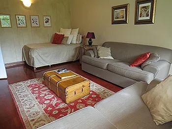 Cozy living room with sofa daybed and a wooden trunk coffee table