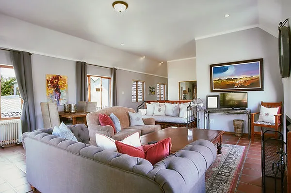 Cozy living room with sofas coffee table and wallmounted TV