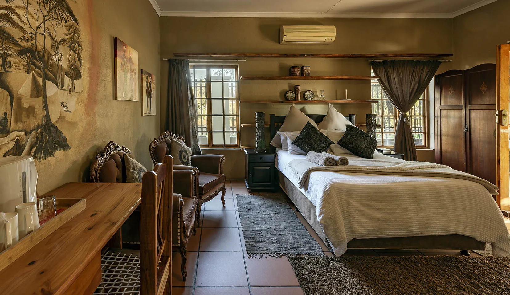 Cozy bedroom with a large bed wooden furniture and warm decor