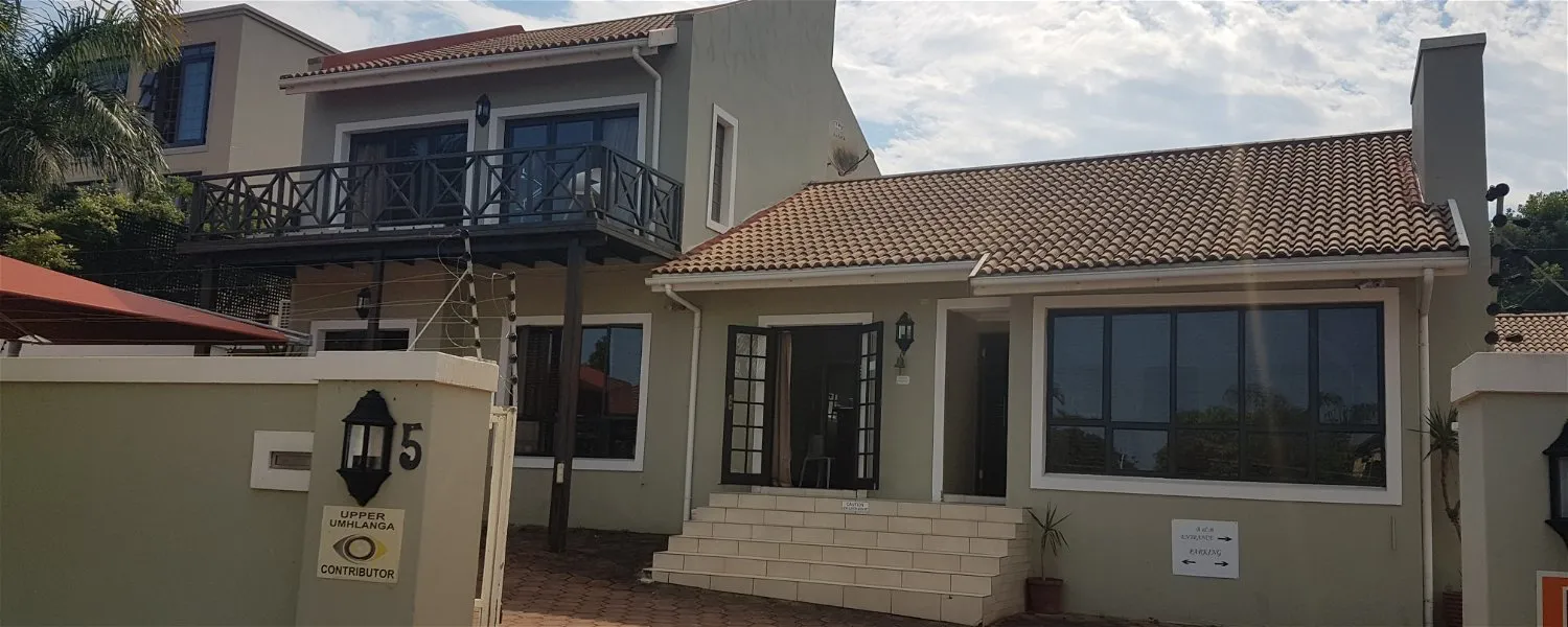 Modern twostory house with balcony tiled roof and front steps