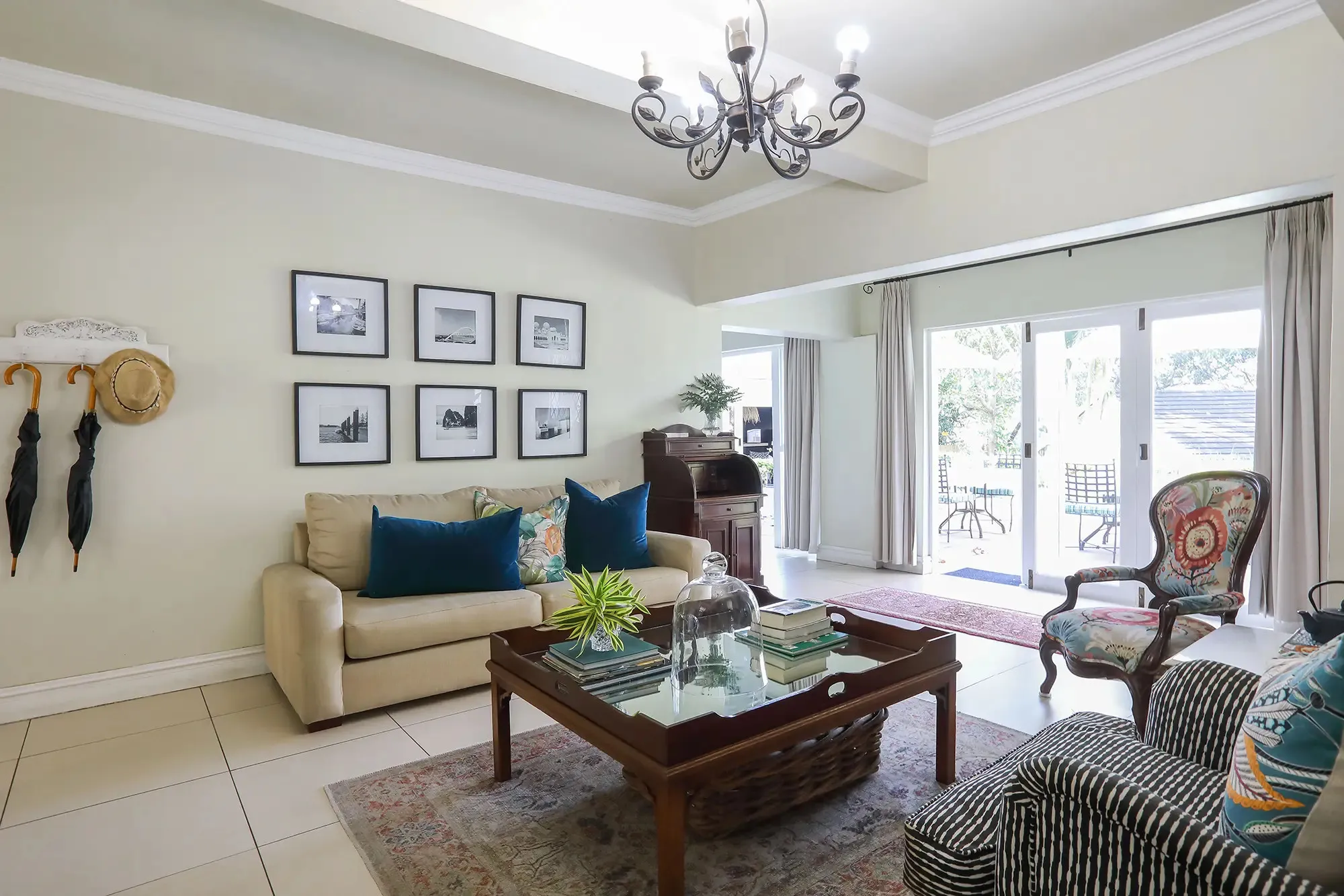 Cozy living room with sofas coffee table and French doors to a patio