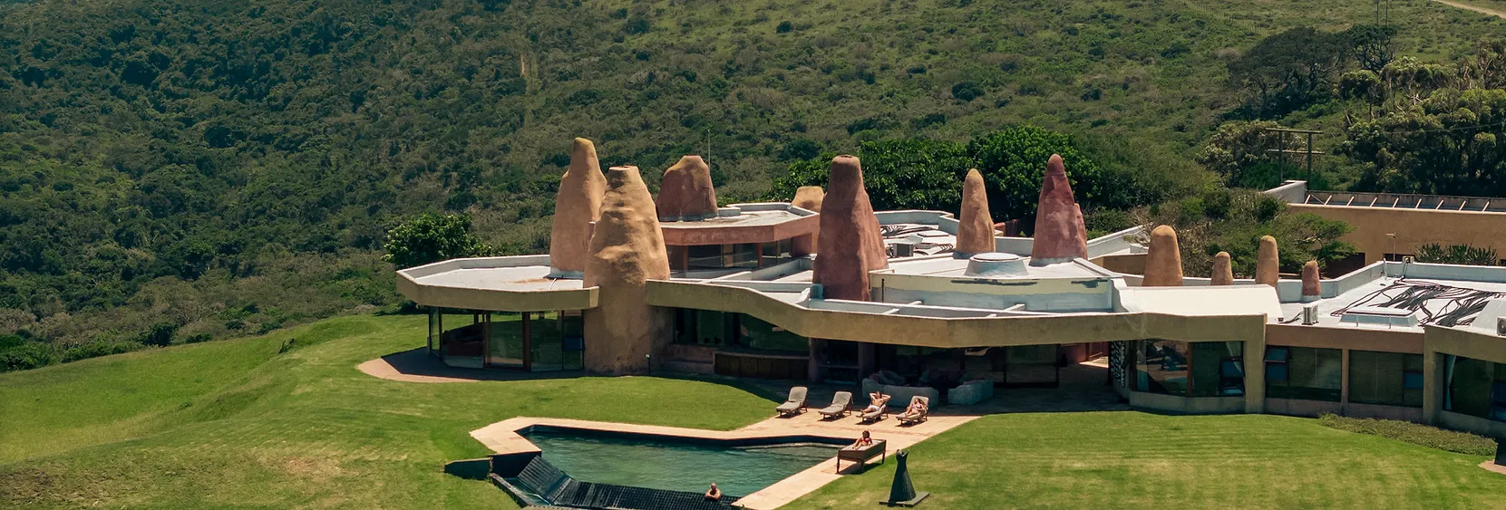 Modern house with unique architecture in a lush green landscape