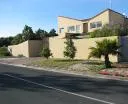 Modern house with beige walls and large windows on a sunny day